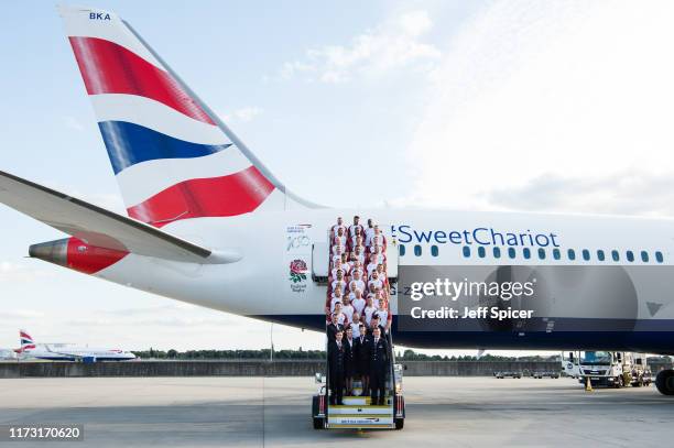 England Rugby's 31 man squad line up in front of their British Airways 'Sweet Chariot' that will fly them to Tokyo, at Heathrow Airport on September...