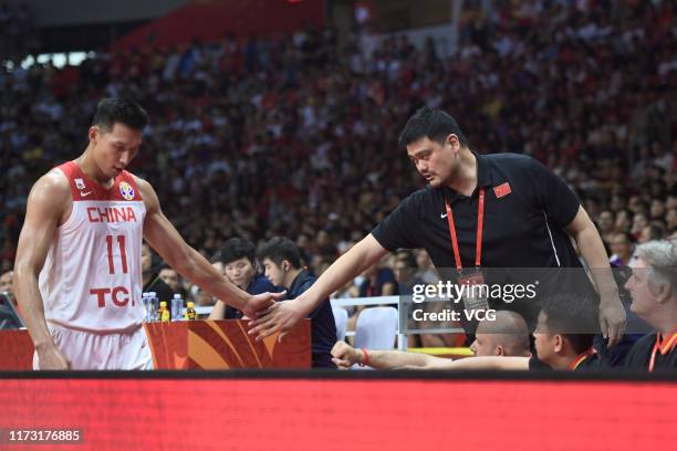 Yao Ming, president of Chinese Basketball Association , and Yi Jianlian of China high-five during FIBA World Cup 2019 Group M match between China and...