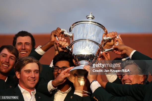 The United States team lift The Walker Cup as they celebrate victory following the singles matches during Day 2 of the Walker Cup at Royal Liverpool...