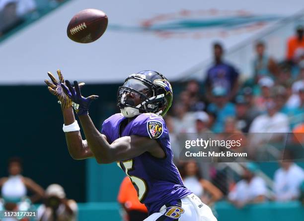 Marquise Brown of the Baltimore Ravens catches a pass for a touchdown in the first quarter against the Miami Dolphins at Hard Rock Stadium on...