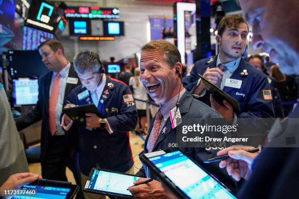 Traders and financial professionals work on the floor of the New York Stock Exchange at the closing bell on October 2, 2019 in New York City. The Dow...