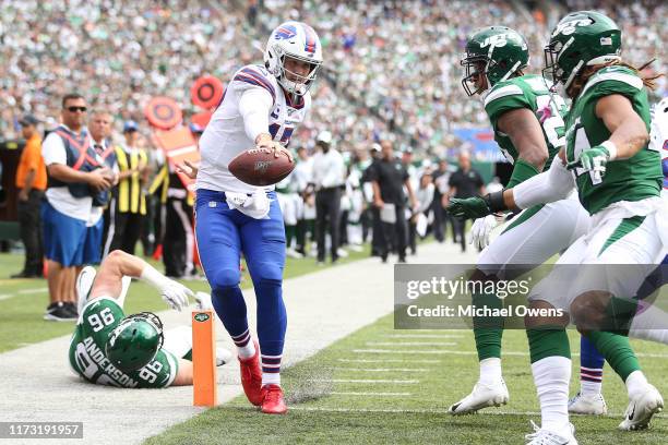 Josh Allen of the Buffalo Bills scrambles for a touchdown against the New York Jets during the fourth quarter at MetLife Stadium on September 08,...