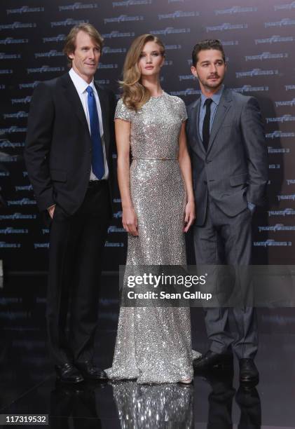 Director Michael Bay, actress Rosie Huntington-Whiteley and actor Shia LaBeouf attend the "Transformers 3" European premiere on June 25, 2011 in...