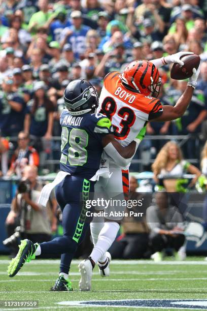 Tyler Boyd of the Cincinnati Bengals completes a catch against Ugo Amadi of the Seattle Seahawks in the first quarter during their game at...