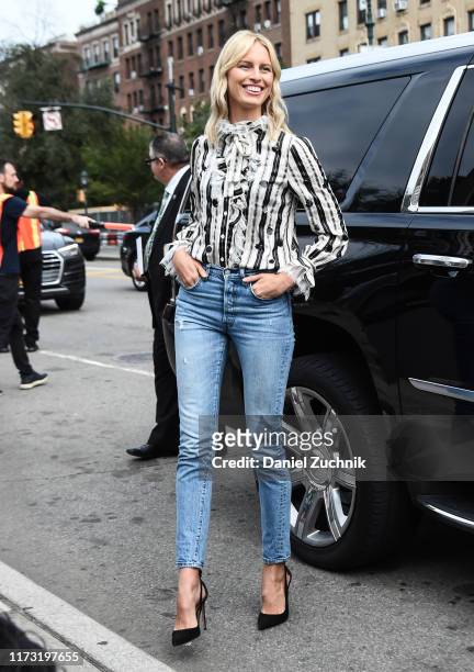 Karolina Kurkova is seen wearing a Tory Burch top and blue Levis jeans and Aquazzura shoes outside the Tory Burch show during New York Fashion Week...