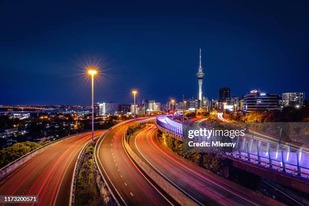 new zealand auckland light path city highway traffic at night - auckland light path stock pictures, royalty-free photos & images