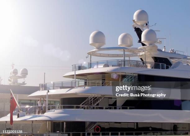 luxury yachts moored in the marina of port vell in barcelona, spain - luxury yacht stock pictures, royalty-free photos & images