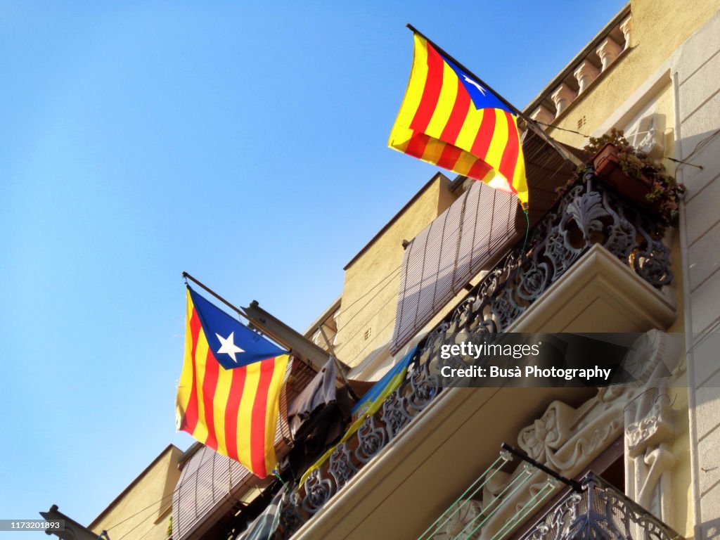 Catalan independence flags ("Esteladas") hanging from balcony in the Barceloneta district, Barcelona, Catalonia, Spain