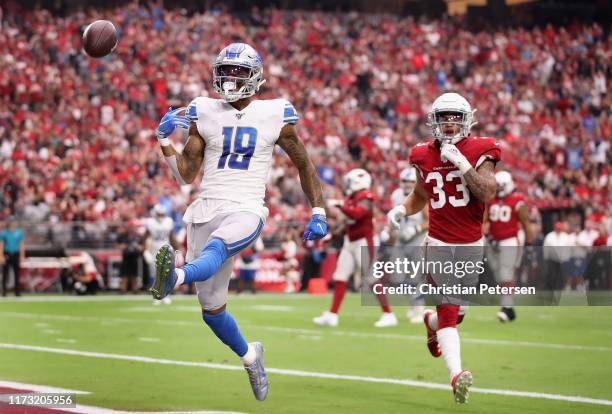 Wide receiver Kenny Golladay of the Detroit Lions celebrates after scoring a nine yard touchdown reception ahead of cornerback Byron Murphy of the...