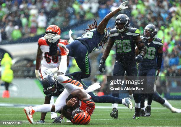 Giovani Bernard of the Cincinnati Bengals is tackled alongside Shaquill Griffin of the Seattle Seahawks in the third quarter during their game at...