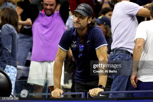 Carlos Moyá, coach of Rafael Nadal of Spain, watches the Men's Singles final match between Rafael Nadal of Spain and Daniil Medvedev of Russia on day...