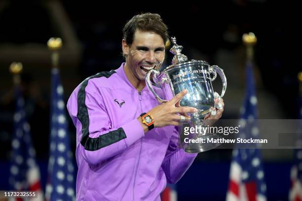 Rafael Nadal of Spain celebrates with the championship trophy during the trophy presentation ceremony after winning his Men's Singles final match...