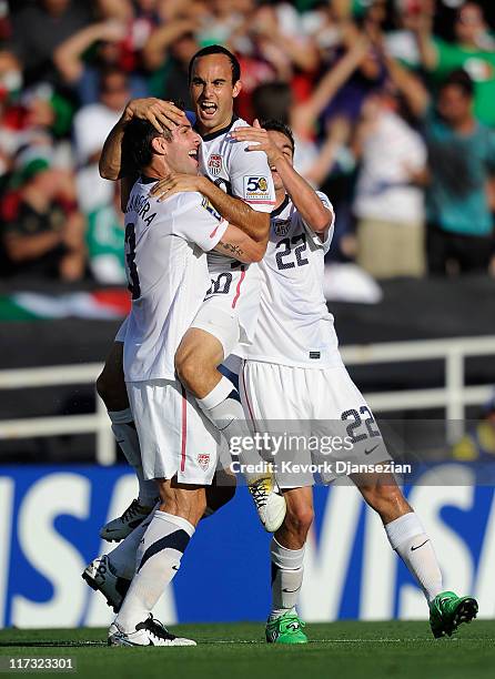 Landon Donovan of United States celebrates his goal with teammates Carlos Bocanegra and Alejandro Bedoya against Mexico during the 2011 CONCACAF Gold...