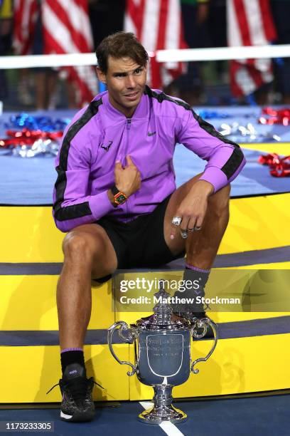 Rafael Nadal of Spain celebrates with the championship trophy during the trophy presentation ceremony after winning his Men's Singles final match...