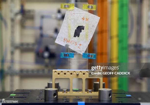 Piece of Herculaneum scroll is pictured in the experimental hutch area after recently being scanned, at Diamond Light Source in Didcot, west of...