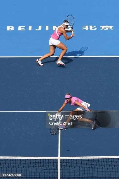 Nicoloe Melichar of the United States and Kveta Peschke of Czech Republic return a shot against their Women's doubles Quarterfinal match of 2019...