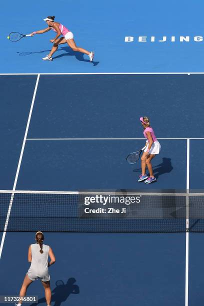 Nicoloe Melichar of the United States and Kveta Peschke of Czech Republic return a shot against their Women's doubles Quarterfinal match of 2019...