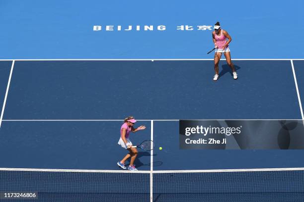 Nicoloe Melichar of the United States and Kveta Peschke of Czech Republic return a shot against their Women's doubles Quarterfinal match of 2019...