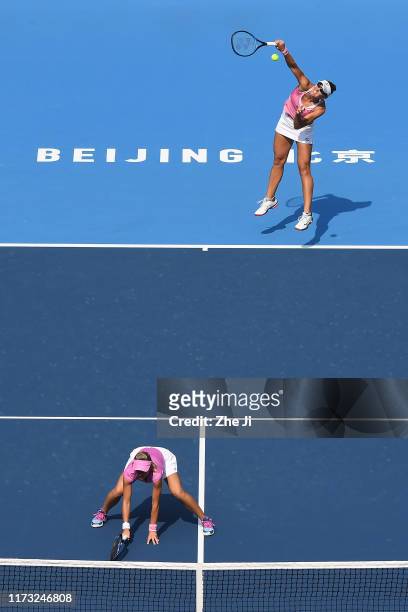 Nicoloe Melichar of the United States and Kveta Peschke of Czech Republic return a shot against their Women's doubles Quarterfinal match of 2019...