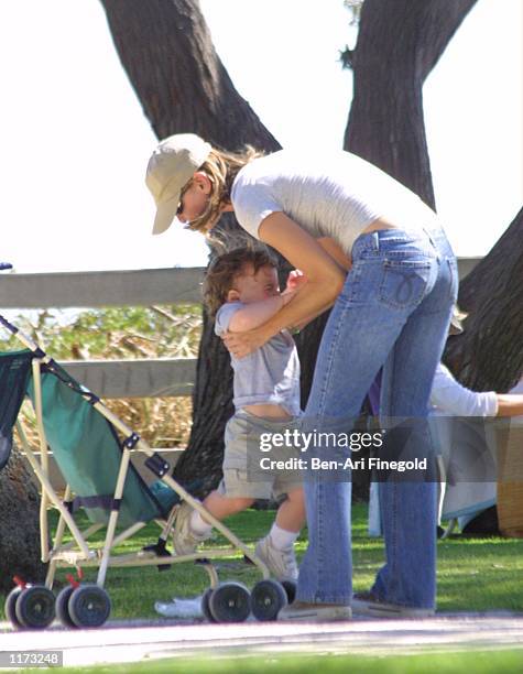 Actress Calista Flockhart and her son Liam spend time in the park on July 24, 2002 in Santa Monica, California.