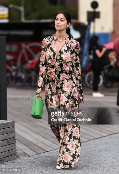 Caroline Issa is seen wearing a floral dress and green bag outside the Jason Wu show during New York Fashion Week S/S20 on September 08, 2019 in New...