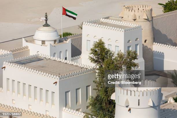 The national flag of the United Arab Emirates flies above the Qasr Al Hosn palace fort in Abu Dhabi, United Arab Emirates, on Wednesday, Oct. 2,...
