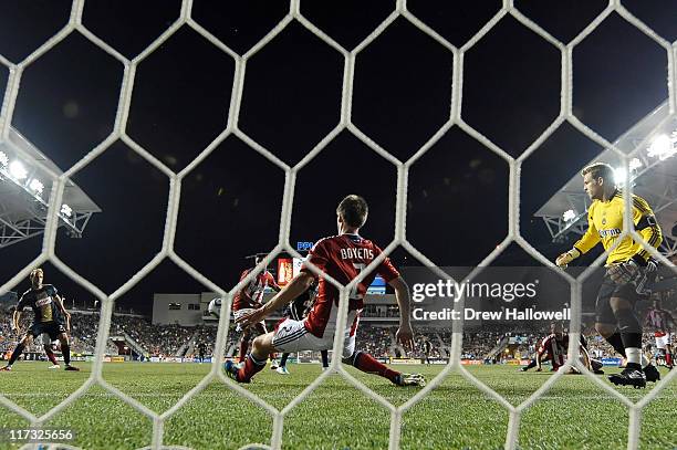 Andrew Boyens of the Chivas USA makes a save with goaltender Dan Kennedy out of position during the game against Philadelphia Union at PPL Park on...