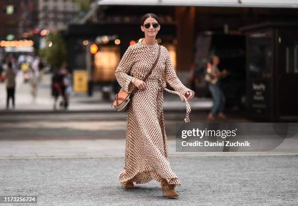 Guest is seen wearing a Jason Wu dress outside the Jason Wu show during New York Fashion Week S/S20 on September 08, 2019 in New York City.