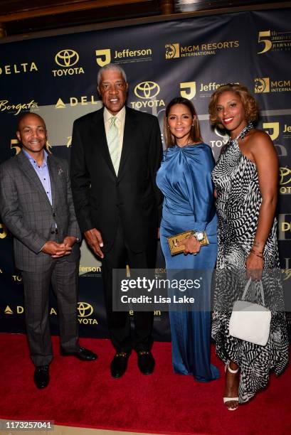 Guest, Julius Erving, Dorys Erving and Jazmin Erving walk the Red Carpet during the Julius Erving Red Carpet and Pairings Party at Premier Night Club...