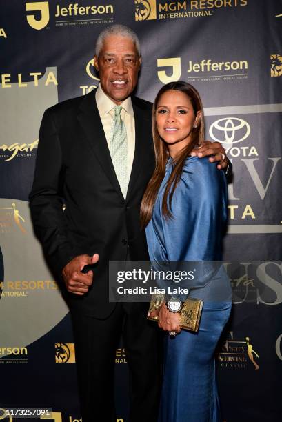 Julius Erving and Dorys Erving walk the Red Carpet during the Julius Erving Red Carpet and Pairings Party at Premier Night Club at the Borgata Hotel...