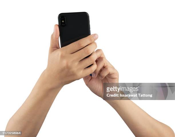 female hand holding and touching on mobile smartphone show back side. - hands holding photos et images de collection