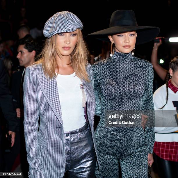 Bella Hadid and Gigi Hadid attend the TOMMYNOW New York Fall 2019 fashion show at The Apollo Theater on September 08, 2019 in New York City.