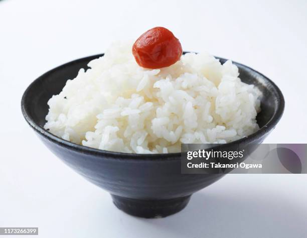 rice , cooked rice steamed rice on bowl , umeboshi pickled plum - rice bowl stockfoto's en -beelden