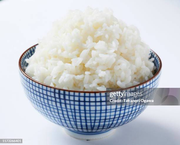 rice , cooked rice steamed rice on bowl - rice bowl stock-fotos und bilder