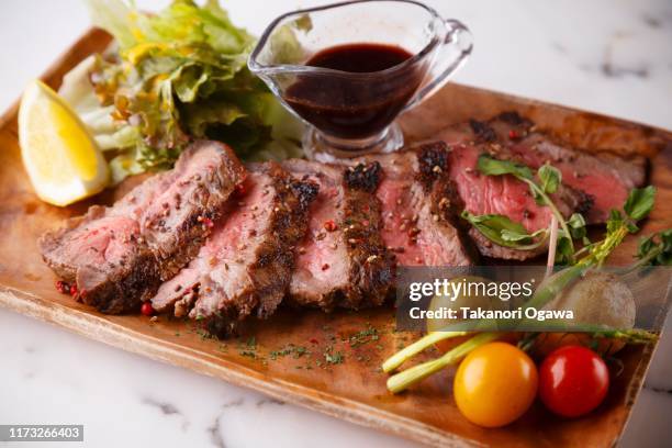 steak , grilled beef with vegetables on the wood plate - roast beef dinner stock pictures, royalty-free photos & images