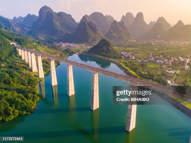 high-speed highway through the karst landform - images of china railway high speed trains stock pictures, royalty-free photos & images