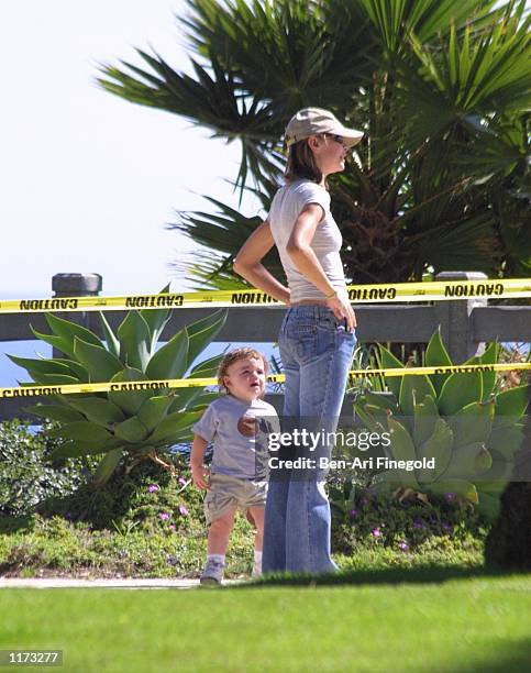 Actress Calista Flockhart and her son Liam spend time in the park on July 24, 2002 in Santa Monica, California.