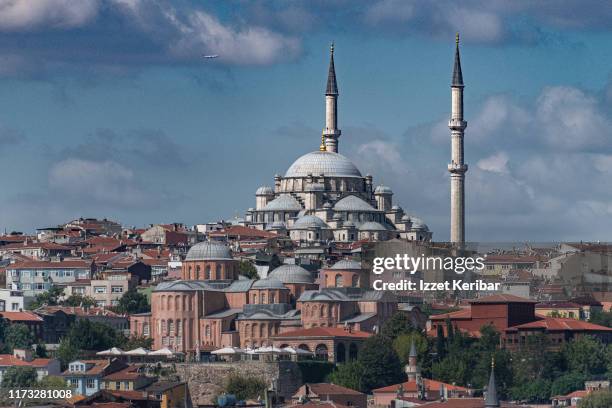 distant image of the fatih mosque and the molla zeyrek ( old pantocrator) mosque, istanbul turkey - fatih mosque stock pictures, royalty-free photos & images