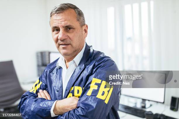 portrait of an fbi agent in an office - fbi stock pictures, royalty-free photos & images