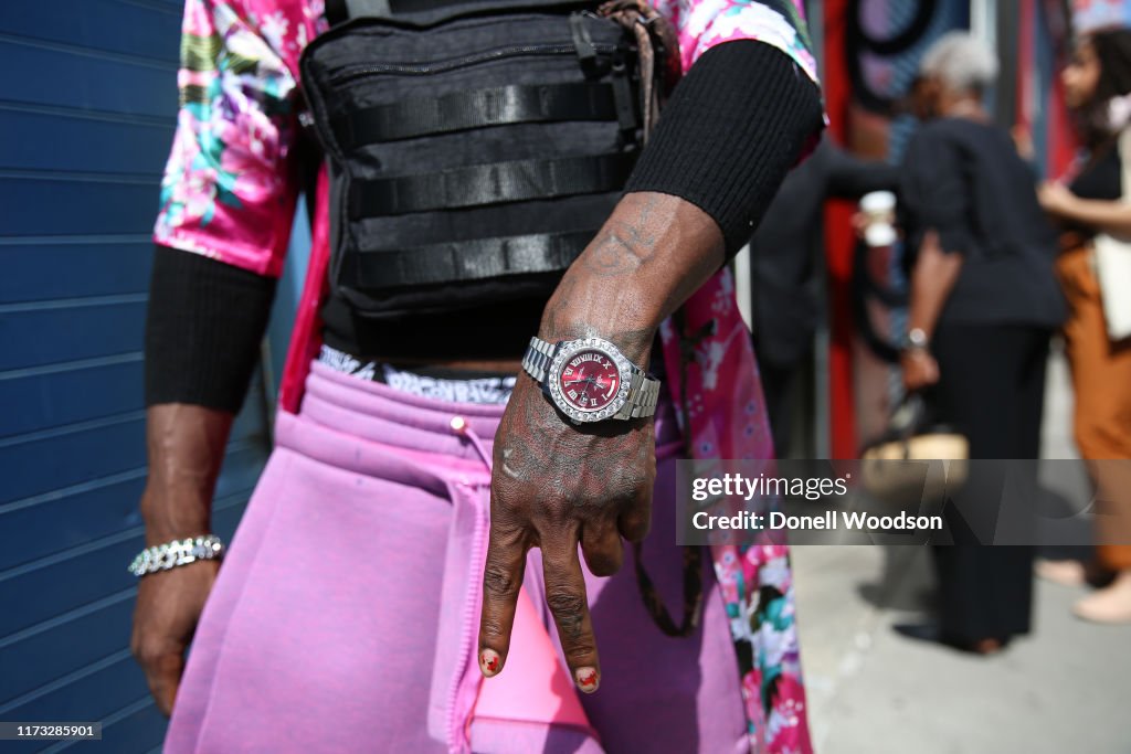 Clinton Lord Rapper Musician CLINTN LORD poses wearing accessories outside the Laquan ...