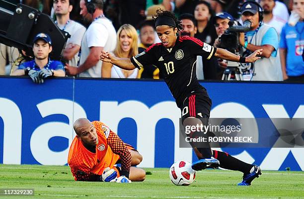 Mexico's Giovani DosSantos drives the ball past USA goalkeeper Tim Howard to score a goal during the CONCACAF 2011 Gold Cup final June 25, 2011 at...