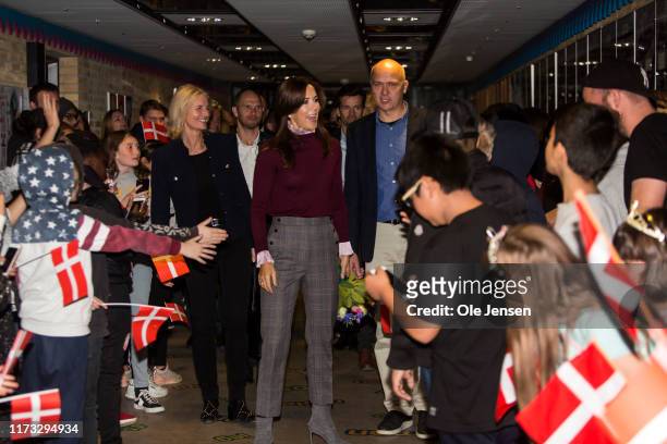 Crown Princess Mary of Denmark is welcomed by hundreds of school children during a school visits near Copenhagen where kids work with a project about...