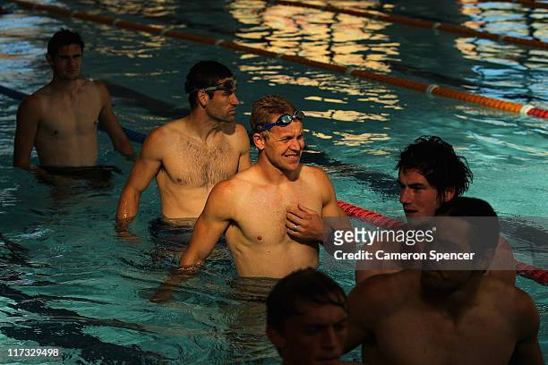 Ryan O'Keefe of the Swans and team mates walk lenths of the pool during a Sydney Swans AFL recovery session at Ian Thorpe Aquatic Centre on June 26,...