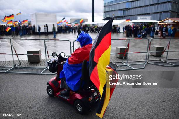 Woman in a wheelchair arrives for a far-right protest at Berlin Central Station on German Unity Day on October 3, 2019 in Berlin, Germany. According...