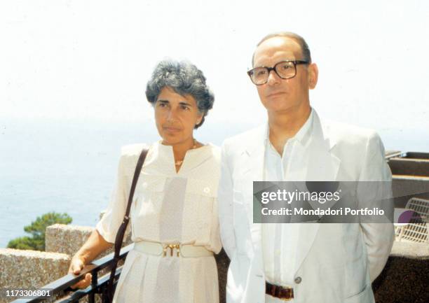 Italian composer and musician Ennio Morricone with his wife Maria Travia. 1980s