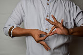 Close up Asian man shows hand gestures it means interpreter appreciation isolated on white background. American sign language