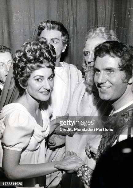 Greek-born American soprano Maria Callas in the role of Paolina, holding hands with the interpreters of the opera by Gaetano Donizetti Poliuto staged...