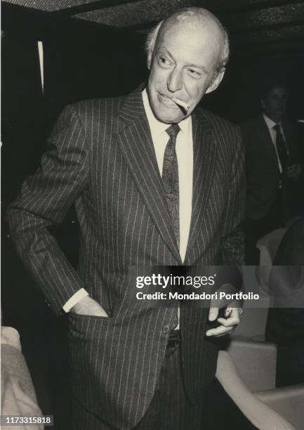 Italian businessman Leopoldo Pirelli smoking. 1980s