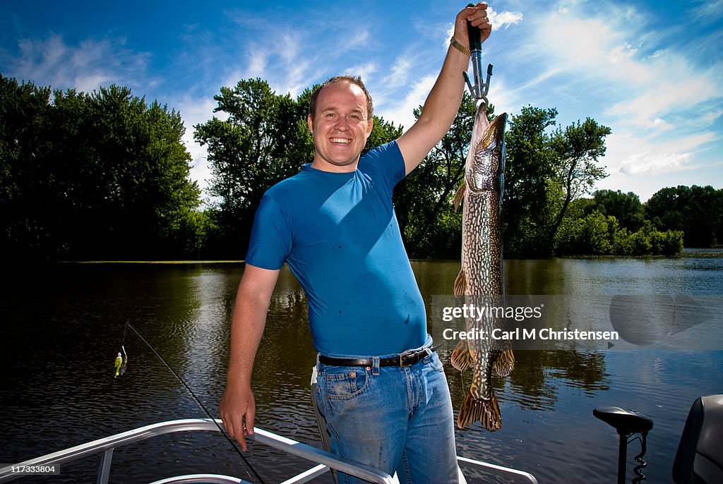 Fisherman holding fish