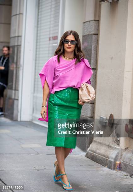 Paola Alberdi is seen wearing pink pants, green skirt with slit outside Tibi during New York Fashion Week September 2019 on September 08, 2019 in New...